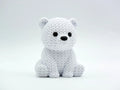 White knitted textured 3D printed baby polar bear figure/ key tag on a white background