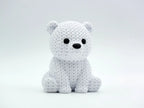 White knitted textured 3D printed baby polar bear figure/ key tag on a white background
