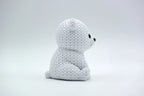White knitted textured 3D printed baby polar bear figure/ key tag on a white background facing side ways