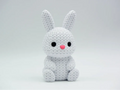 White coloured knitted textured 3D printed Bunny figure/ key tag on a white background