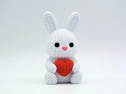 White coloured knitted textured 3D printed Bunny with heart figure/ key tag on a white background