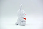 White coloured knitted textured 3D printed Bunny with heart figure/ key tag on a white background facing sideways
