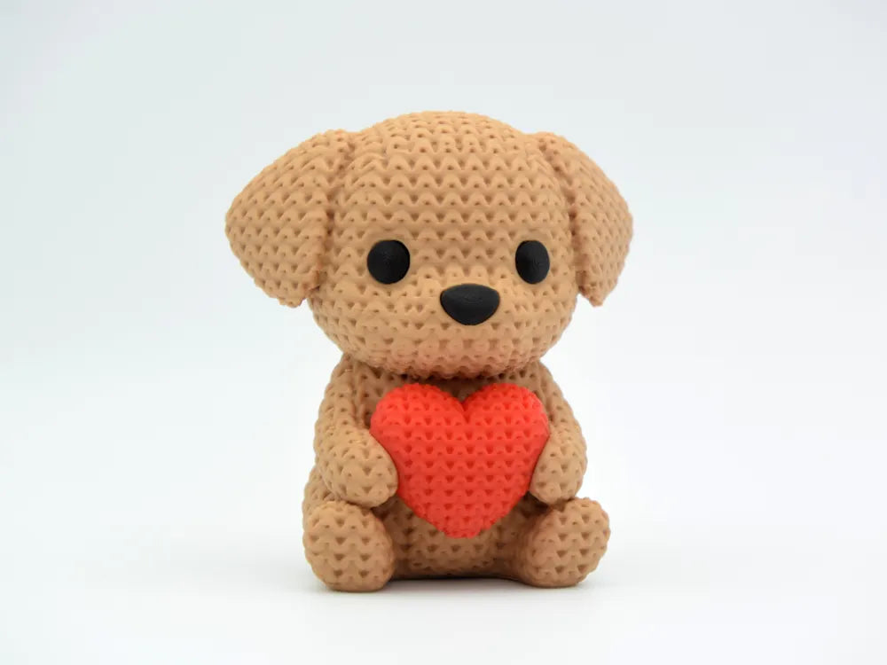 Caramel coloured knitted textured 3D printed Dog with heart figure/ key tag on a white background