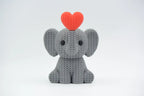 Grey coloured knitted textured 3D printed Elephant with heart figure/ key tag on a white background facing forward