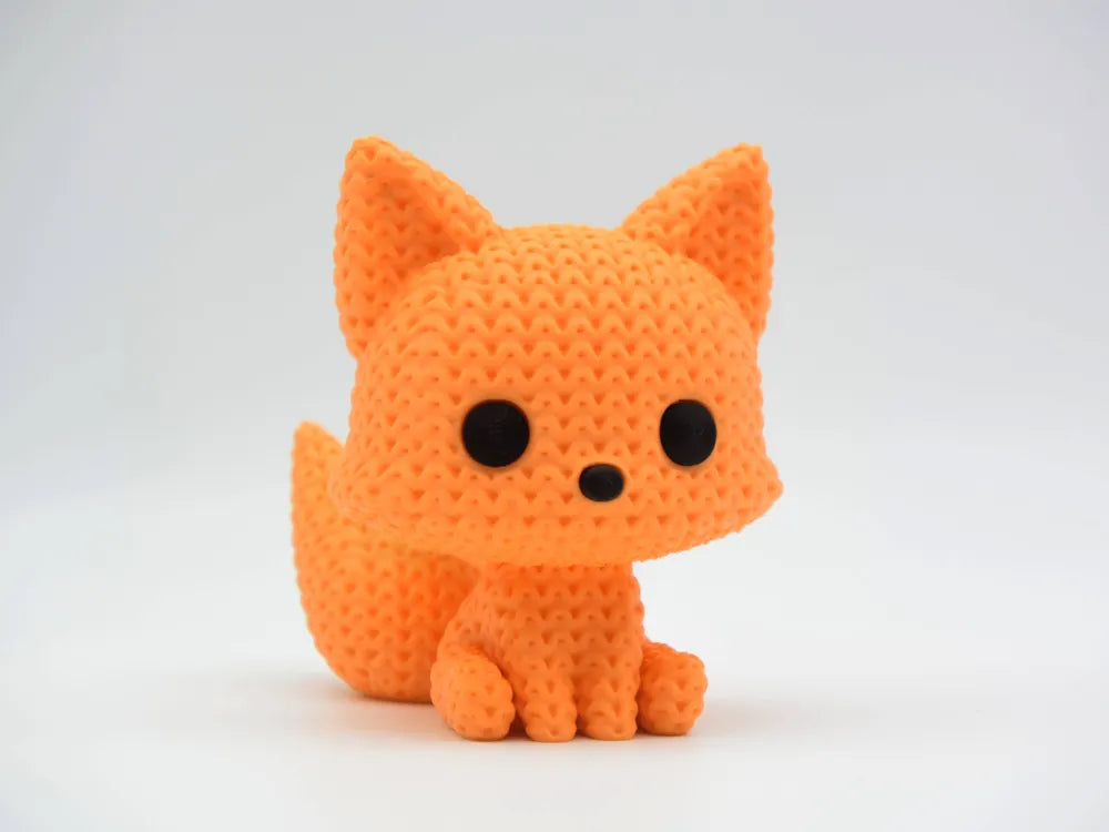 Orange knitted textured 3D printed Fox figure/ key tag on a white background