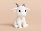 White knitted textured 3D printed Goat figure/ key tag on a light orange background