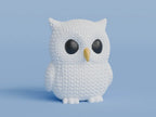 White knitted textured 3D printed Owl figure/ key tag on a light blue background
