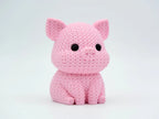 Pink knitted textured 3D printed pig figure/ key tag on a white background