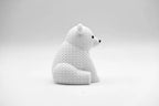 White knitted textured 3D printed polar bear figure/ key tag on a white background facing side ways