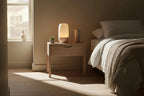 Bedroom with a bedside table and lamp, soft lighting