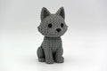 Grey knitted textured 3D printed Wolf figure/ key tag on a white background