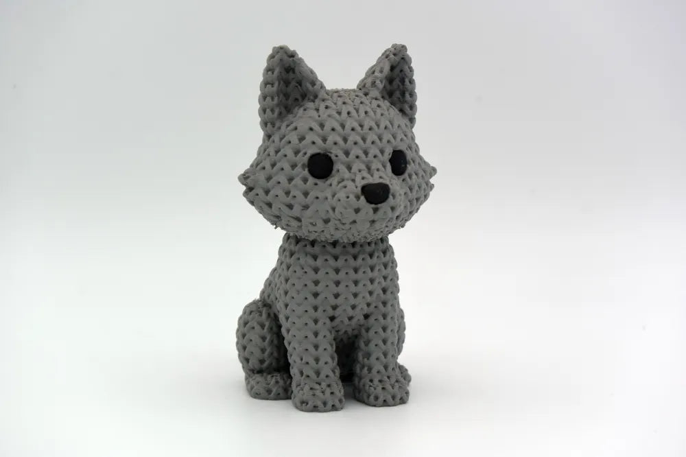Grey knitted textured 3D printed Wolf figure/ key tag on a white background